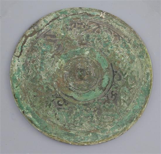 A Chinese bronze circular mirror, Western Han dynasty, 2nd century B.C. 14cm diameter, repair to edge